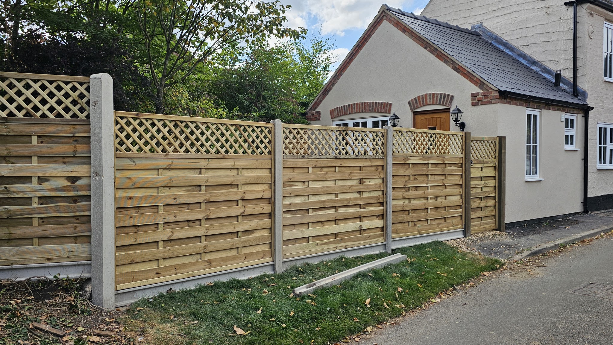 Lattice-topped timber boundary fencing installed by Vale Fencing Harby